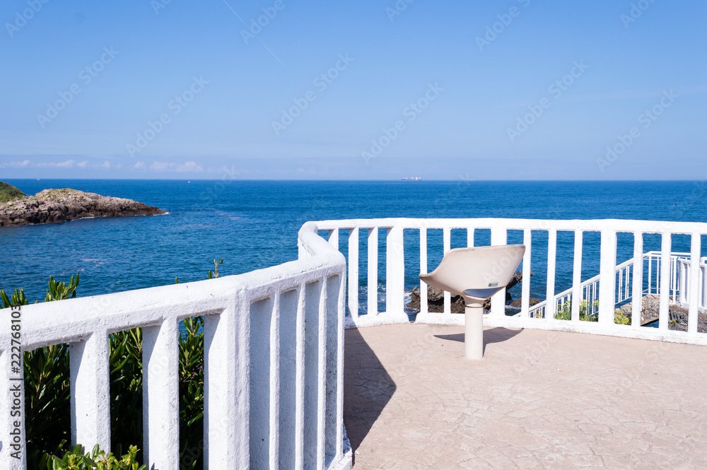 Summer white beach chair with blue sky background