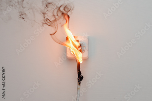 Electrical short circuit. Failure caused by burning wire and rosettes socket plug in house.