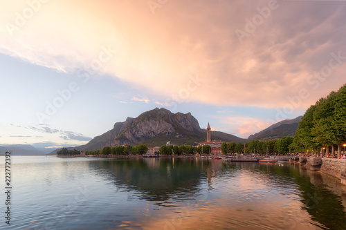 Shining panorama of Lecco Lake at the sunset with huge colorful cloud