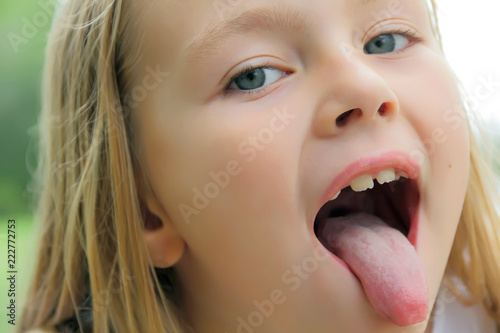 Small girl with put out tongue