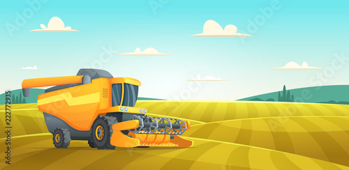 Rural summer landscape with Combine harvester agriculture machine harvesting golden ripe wheat field