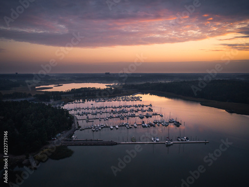 Small boats harbor in sunset photo