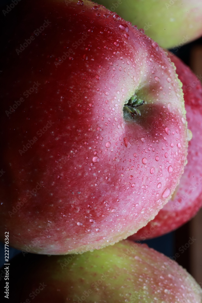 wet apples on a black background wet apples on a black background