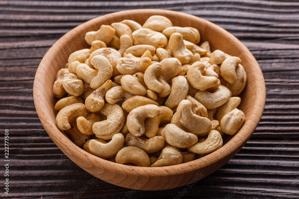 cashew nuts on a rustic wooden background