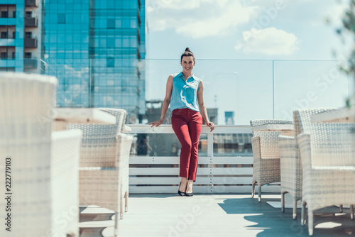 Full length portrait of optimistic woman having leisure while locating outside © Yakobchuk Olena