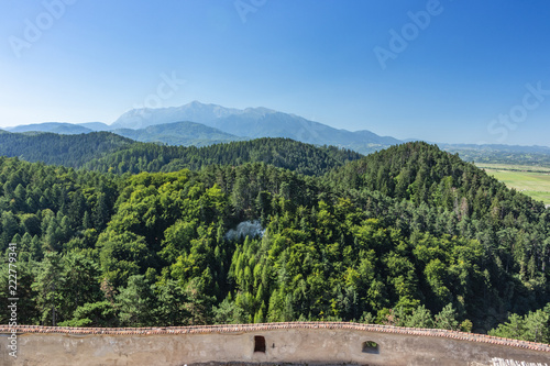fortified wall of the Rasnov castle and a view of the Carpathians, Romania