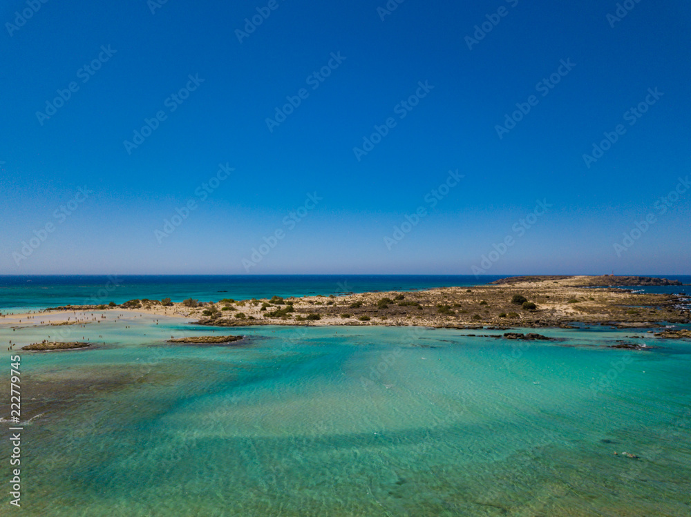 Aerial view to the beautiful beach and island of Elafonisi lagoon. Amazing wallpaper, photo from drone. Crete, Greece.