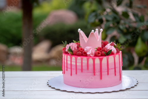 pink cake with crown on birthday