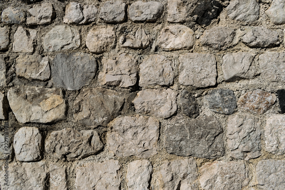 Ancient stone wall in an italian medieval city. Also usable as background, wallpaper or screensaver