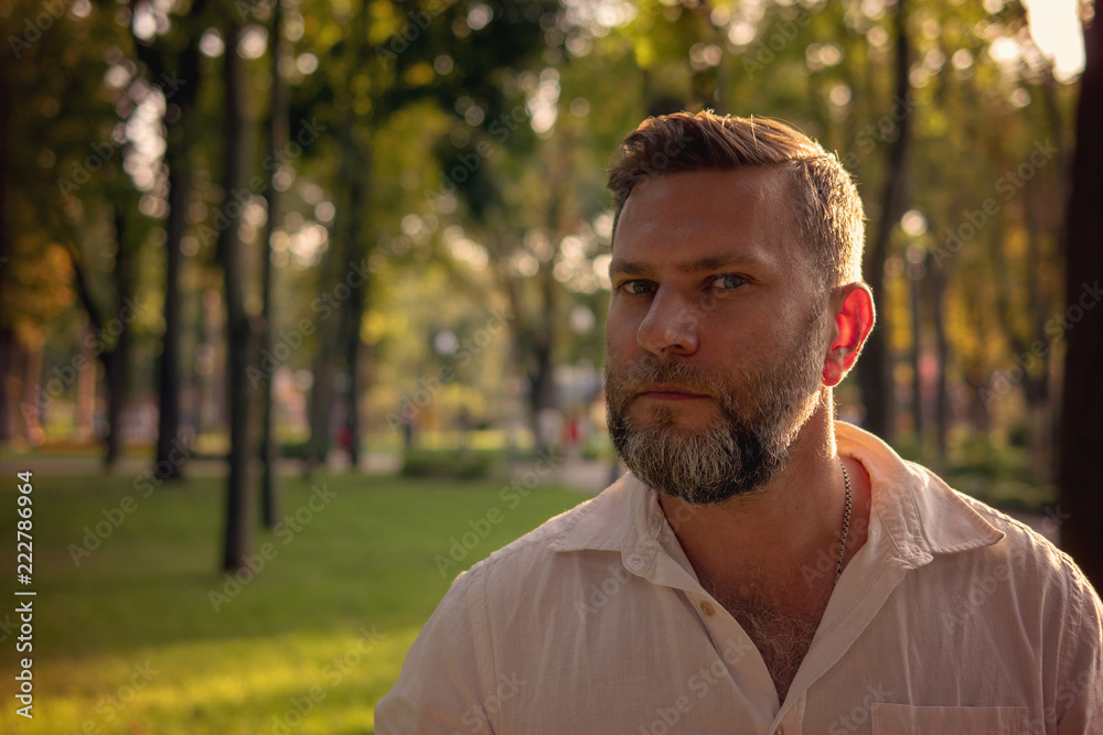 Man with a beard in the park, portrait Man with a beard in the park, portrait