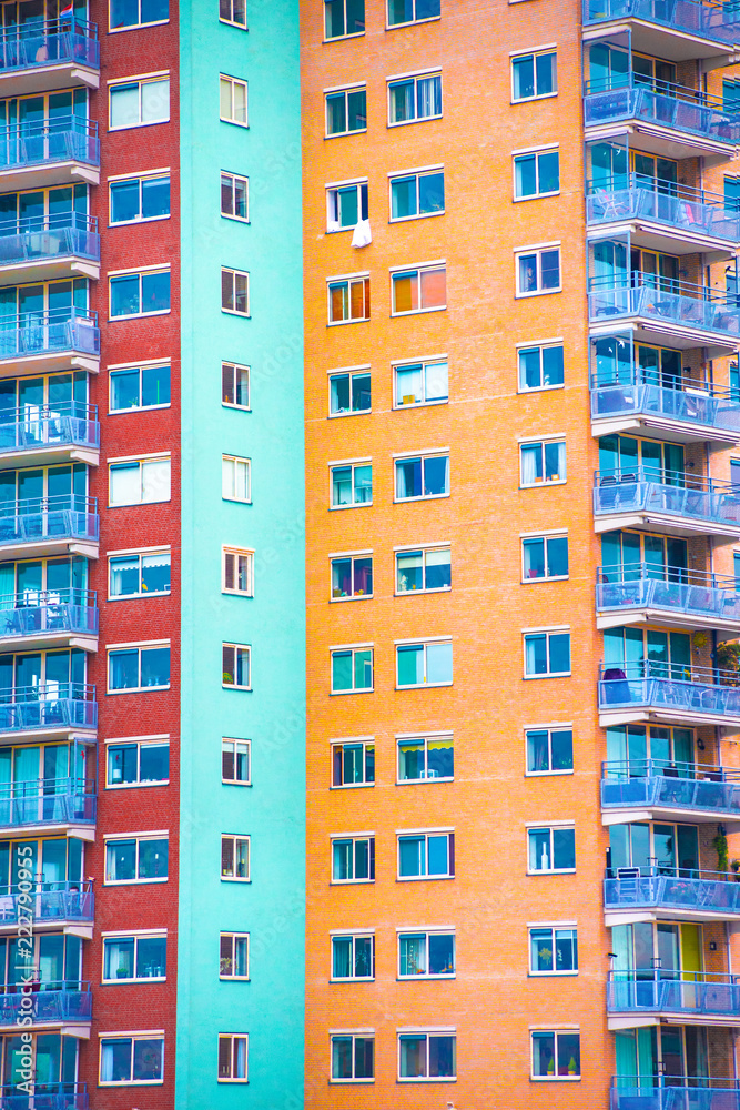 Bright colorful geometric apartment building facade with windows