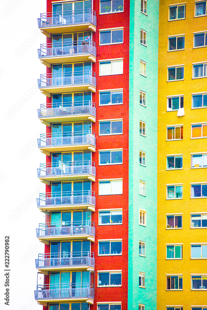Bright colorful geometric apartment building facade with windows Bright colorful geometric apartment building facade with windows