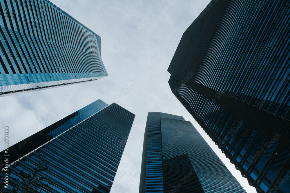 Bottom view to modern skyscrapers at downtown district. Business landscape background. Singapore city