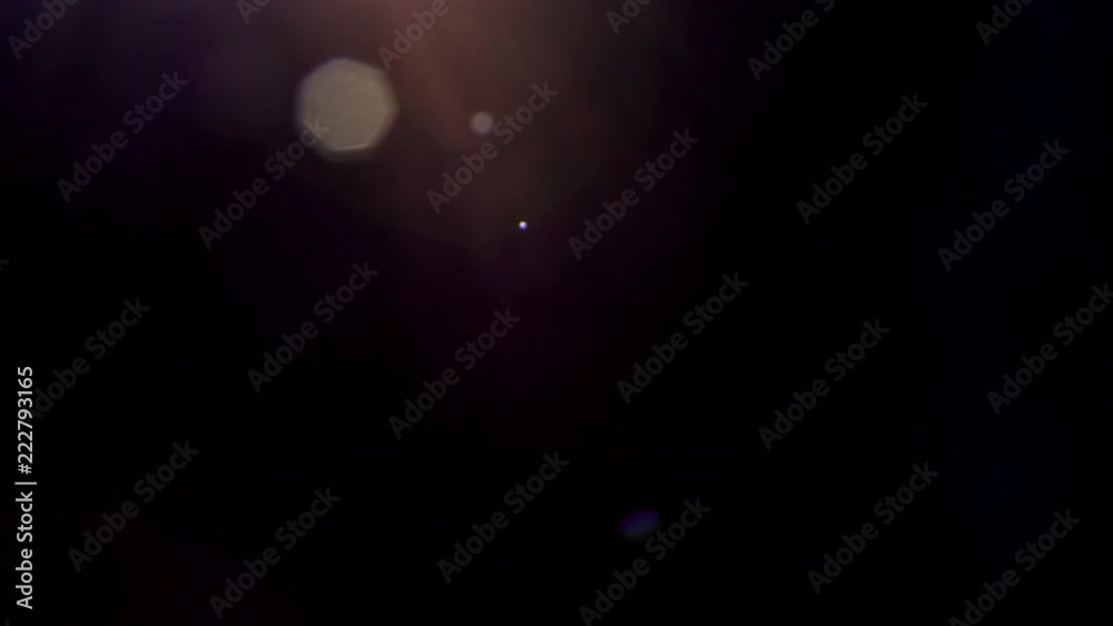 Warm lens flares on black background. Works as overlay on your footage Warm lens flares on black background. Works as overlay on your footage