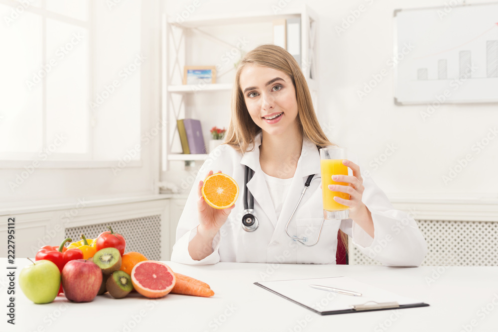 Nutritionist woman with fruit and juice