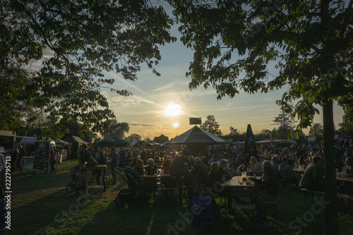 Fototapeta Naklejka Na Ścianę i Meble -  People sitting at a summer festival