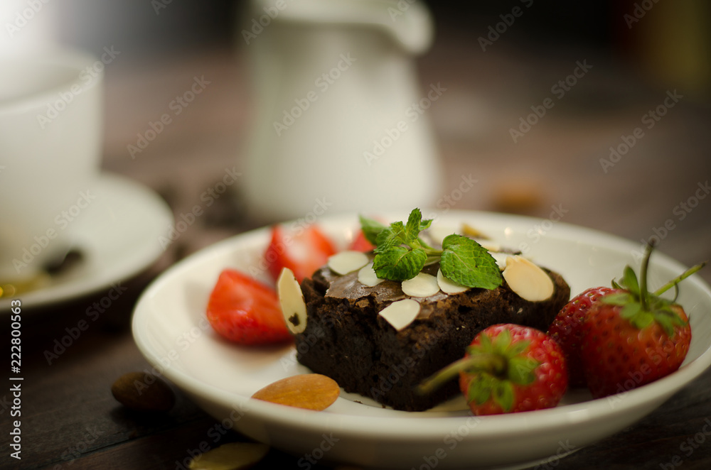 Chocolate brownie, strawberry and coffee with casual day Chocolate brownie, strawberry and coffee with casual day