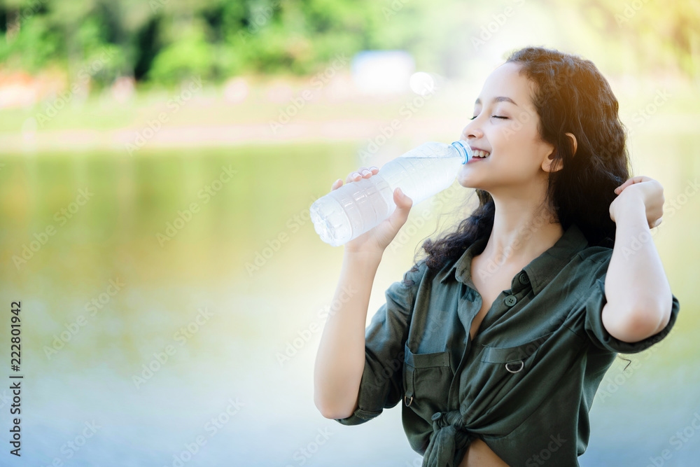 Asian women are drinking clean water. To refresh the body from hot weather in the summer. Feels good And does not cause Heat Stroke. It improves metabolism. boosts energy. Skin looks soft. Rejuvenate Asian women are drinking clean water. To refresh the body from hot weather in the summer. Feels good And does not cause Heat Stroke. It improves metabolism. boosts energy. Skin looks soft. Rejuvenate