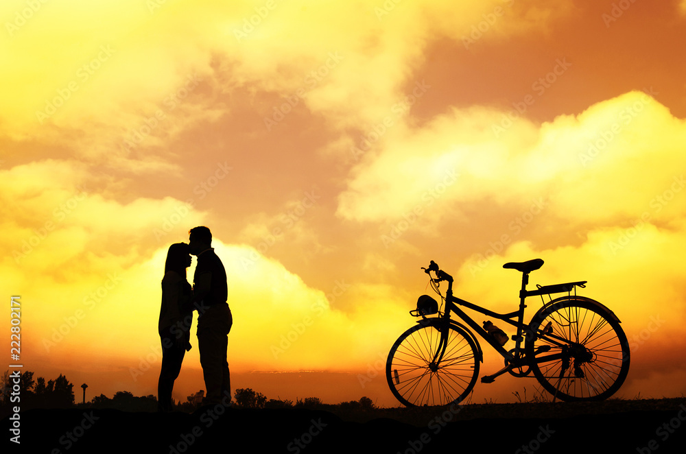 Silhouette of sweet couple in love happy time in beautiful sunset Silhouette of sweet couple in love happy time in beautiful sunset
