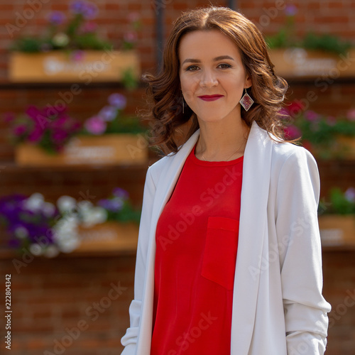 Portrait of a beautiful successful adult woman outdoors