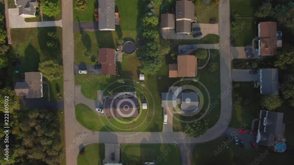An aerial top down flyover view establishing shot of a typical Pennsylvania residential neighborhood with WiFi hotspot target markers over random homes. Pittsburgh suburbs.	 	