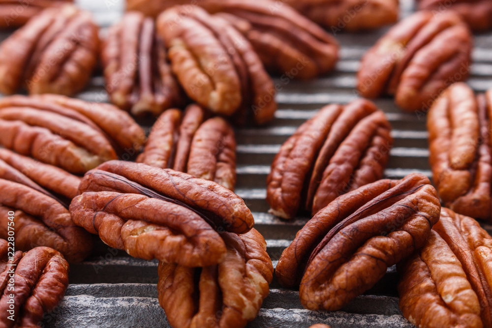 delicious pecan nuts on a rustic wooden background delicious pecan nuts on a rustic wooden background
