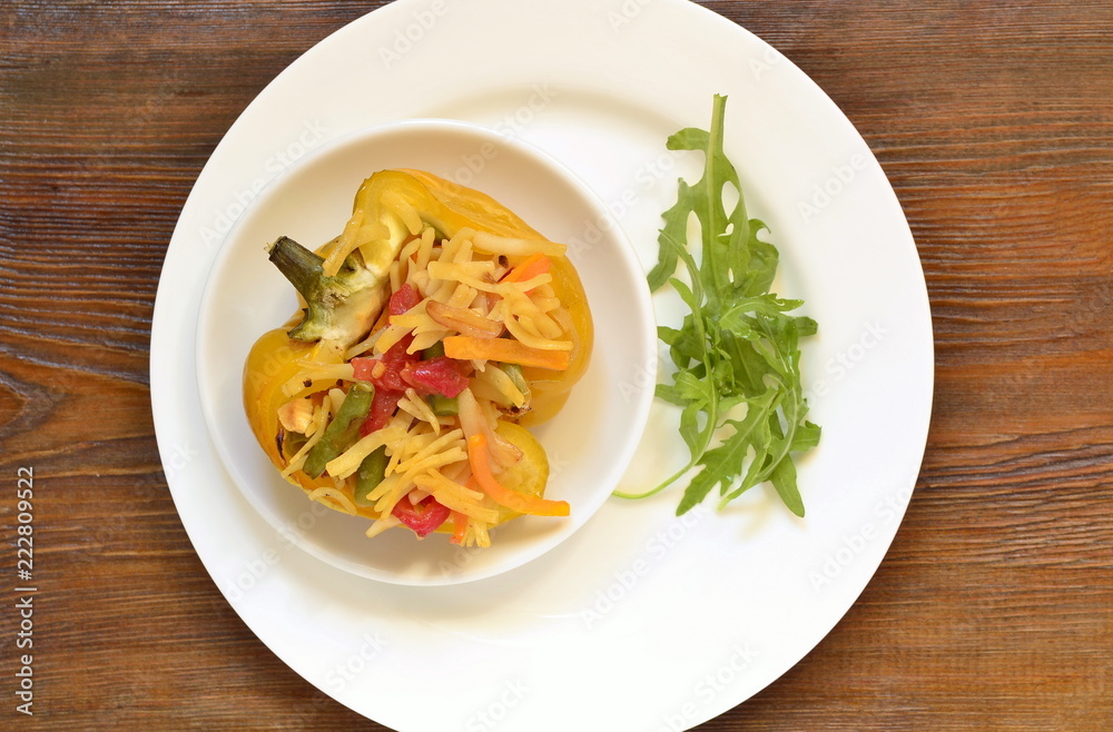 Yellow bell pepper stuffed with vegetables and noodles, top view