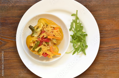 Yellow bell pepper stuffed with vegetables and noodles, top view