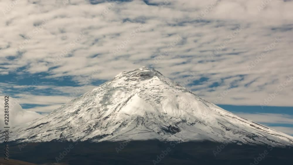Cotopaxi Volcano after a heavy snowfall. Situated in the Ecuadorian Andes, at 5897m is one of the worlds highest volcanoes. Vapour is emanating from fumaroles near the summit. Cotopaxi Volcano after a heavy snowfall. Situated in the Ecuadorian Andes, at 5897m is one of the worlds highest volcanoes. Vapour is emanating from fumaroles near the summit.