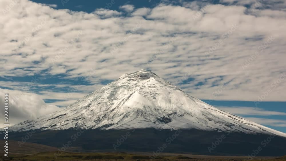 Cotopaxi Volcano after a heavy snowfall. Situated in the Ecuadorian Andes, at 5897m is one of the worlds highest volcanoes. Vapour is emanating from fumaroles near the summit. Cotopaxi Volcano after a heavy snowfall. Situated in the Ecuadorian Andes, at 5897m is one of the worlds highest volcanoes. Vapour is emanating from fumaroles near the summit.
