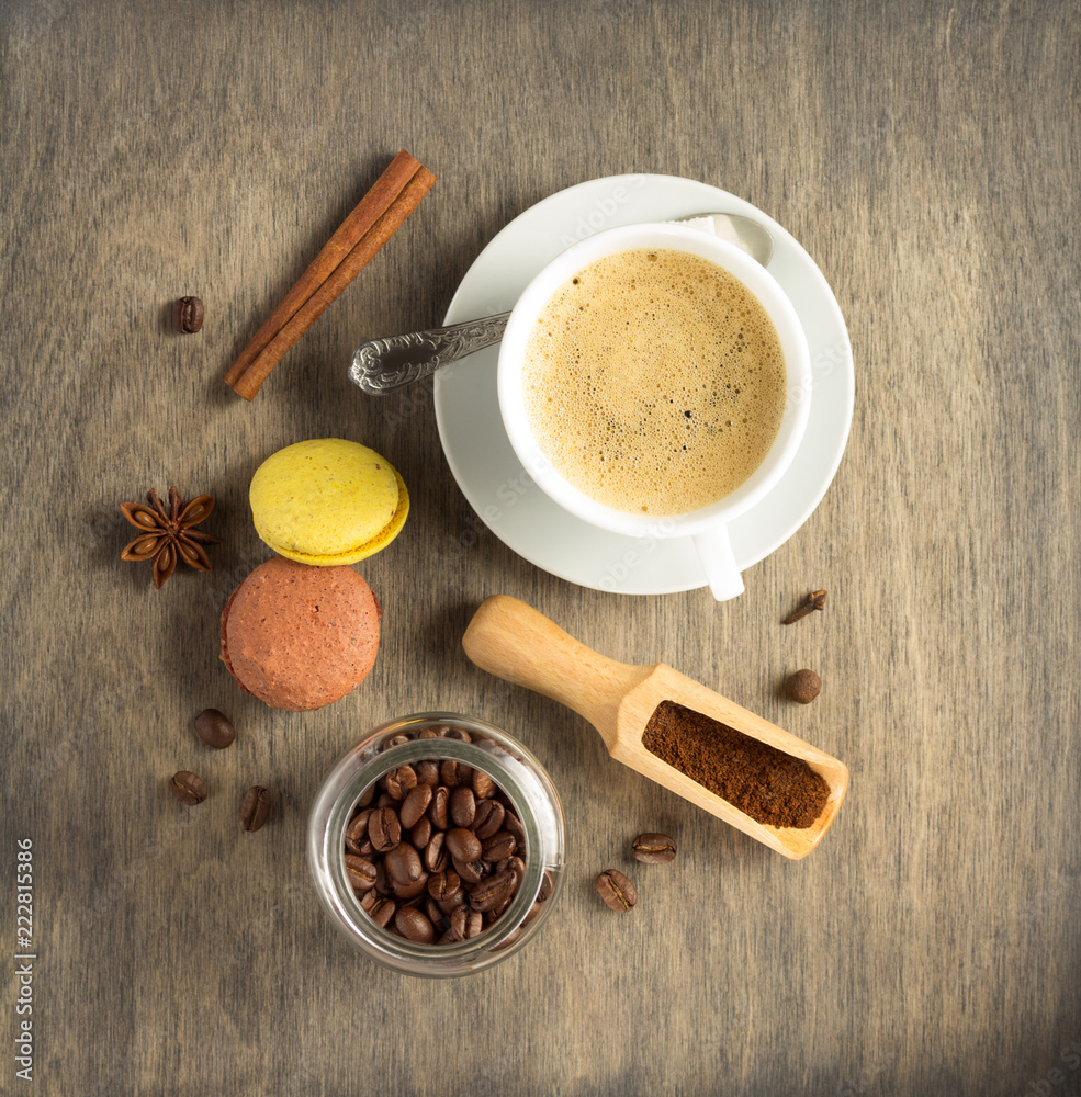 cup of coffee and beans on wooden background cup of coffee and beans on wooden background
