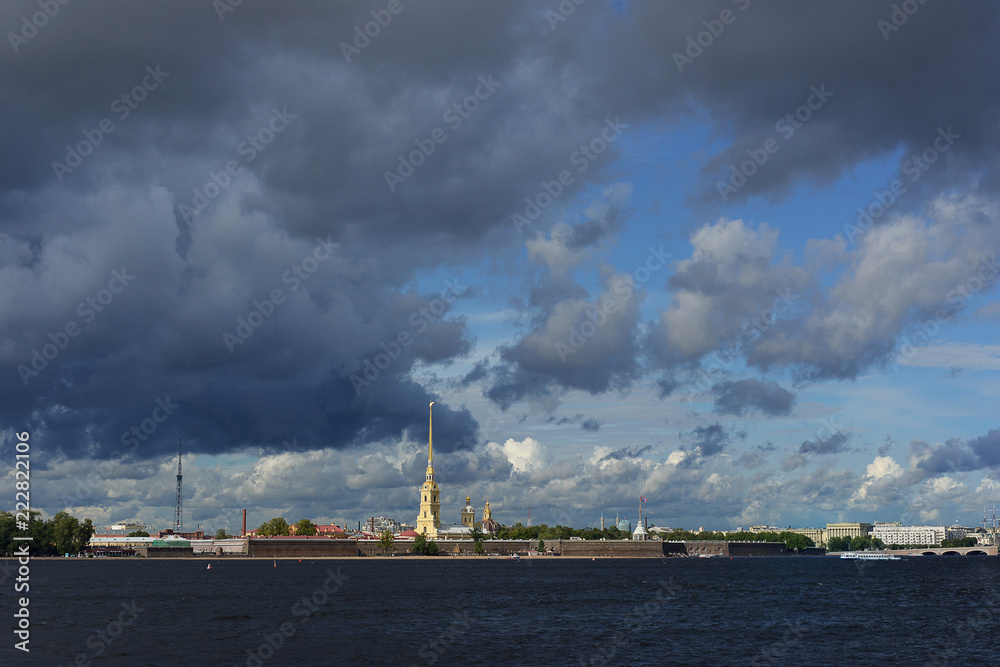 St. Petersburg. View of the Neva and the Peter and Paul Fortress. Thunderstorm cloudy skies.