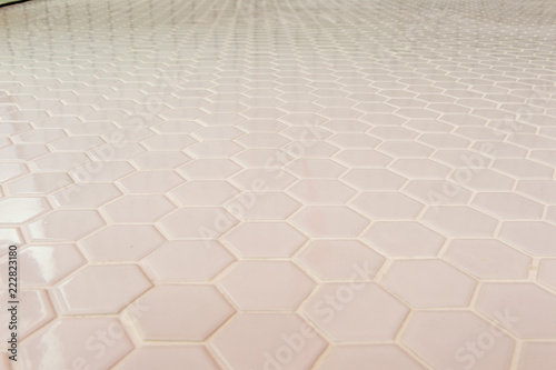 A simple white texture pattern of hexagons as a background © RobbinLee