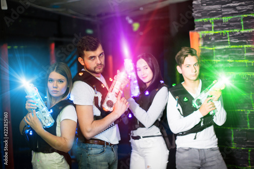 Young people in laser tag labyrinth