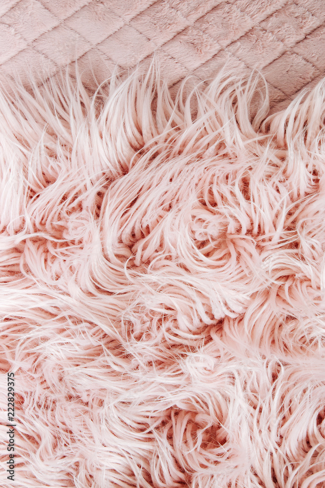 Fototapeta premium Pink fluffy fur background. Flat lay, top view
