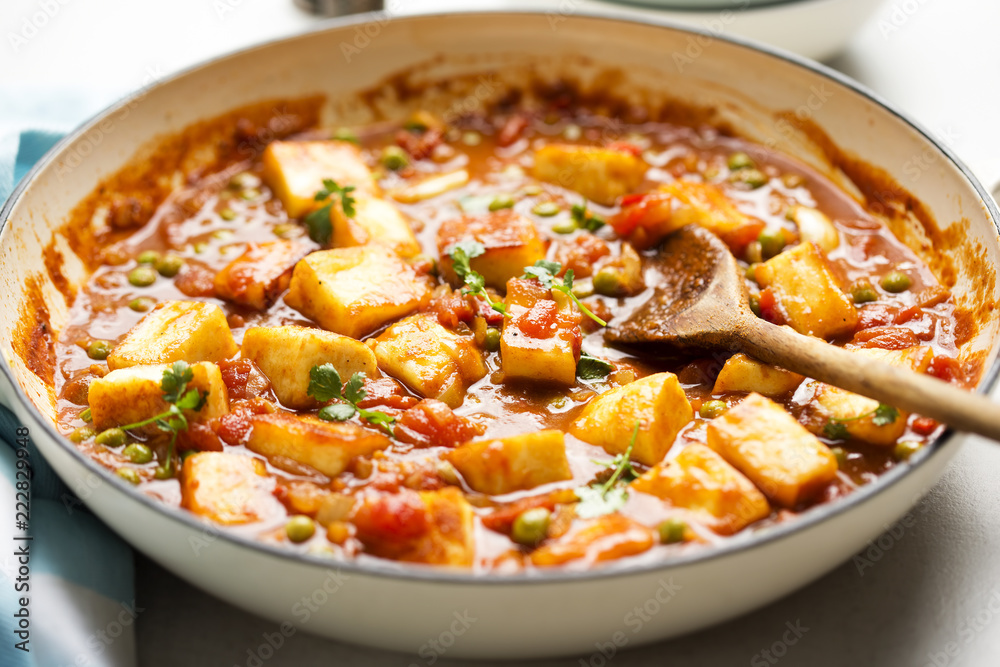 Matar paneer with with paneer cheese, peas and tomato sauce.