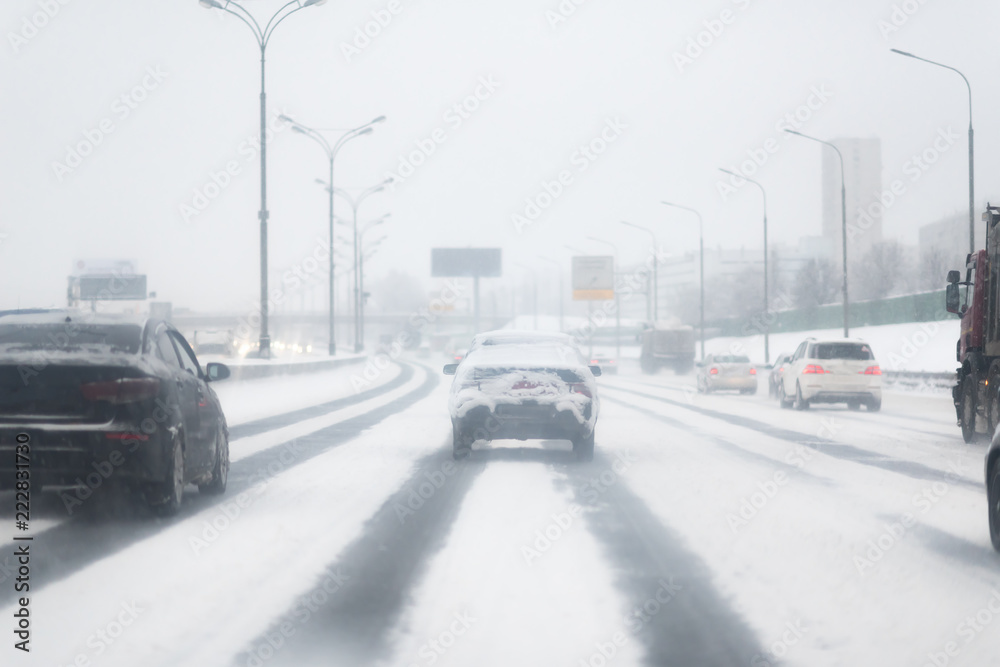 Car with lights on a snow covered road. Car with lights on a snow covered road.
