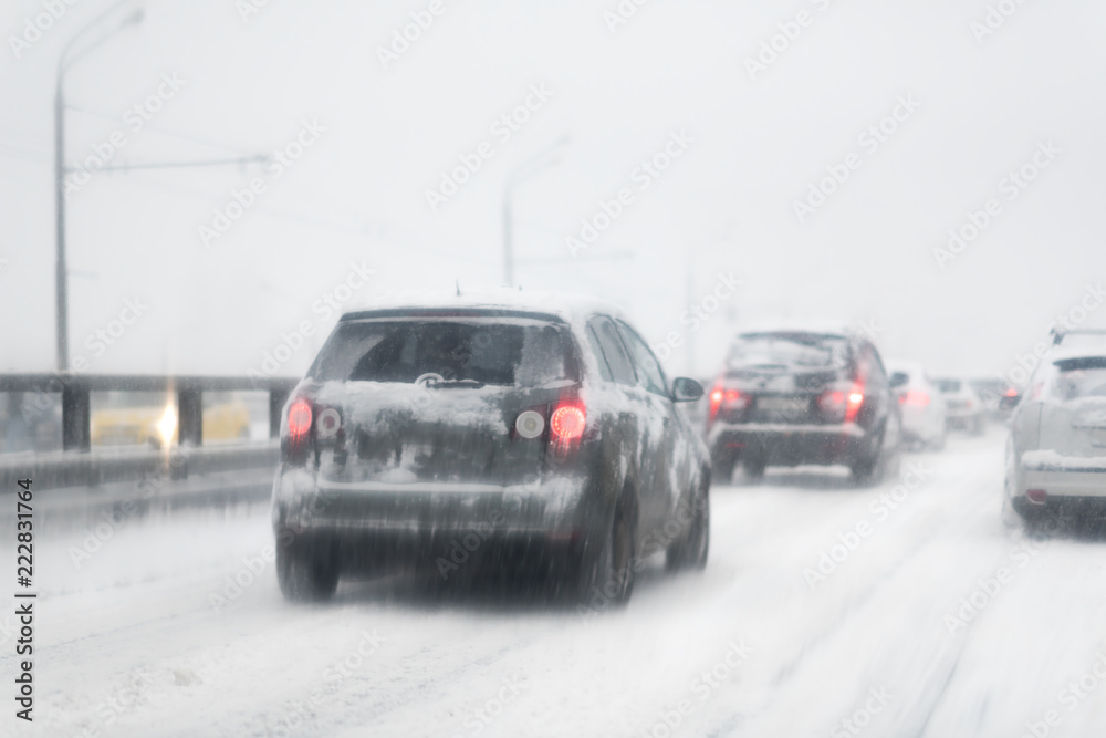 Car with lights on a snow covered road. Car with lights on a snow covered road.