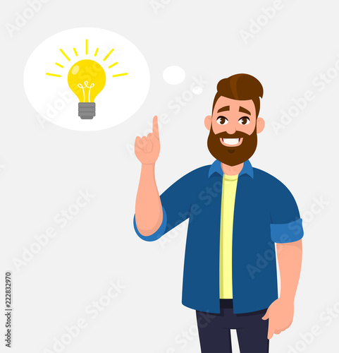 Joyful young man pointing up index finger.  In the thought bubble bulb is  brightening. Idea, innovation, imagination, creativity concept illustration in vector cartoon style.