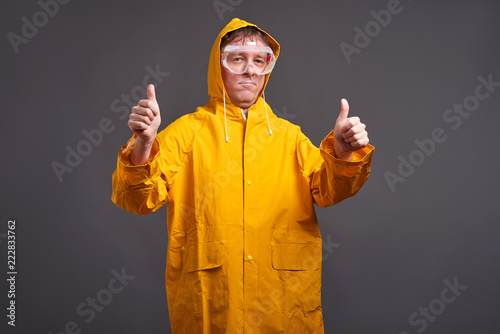 Man in yellow raincoat