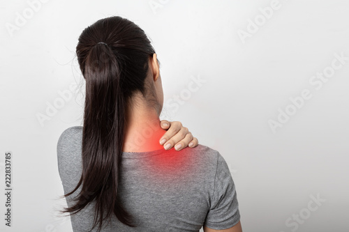 Woman with shoulder pain on white background