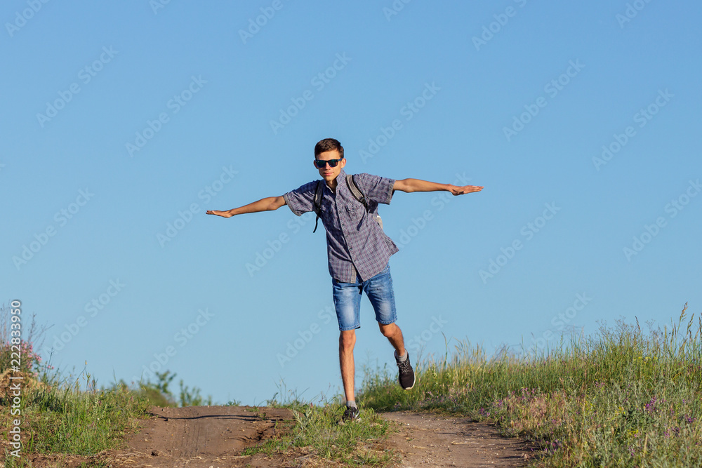 guy jumping to the top on the road, travel concept guy jumping to the top on the road, travel concept