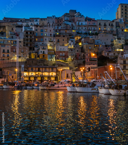 The picturesque city of Sciacca in the evening overlooking its harbour. Province of Agrigento, Sicily.