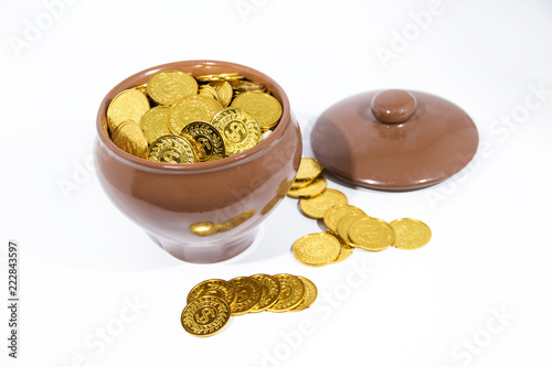 Isolated pot with golden coins. Abstract photo of lucky photo