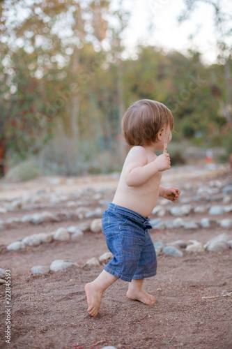 One year old boy playing at the park © MilanSigal