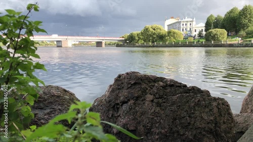 River, bridge, rocks, clouds. Vyborg. Russia.