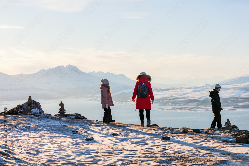 Mother and kids outdoors on winter