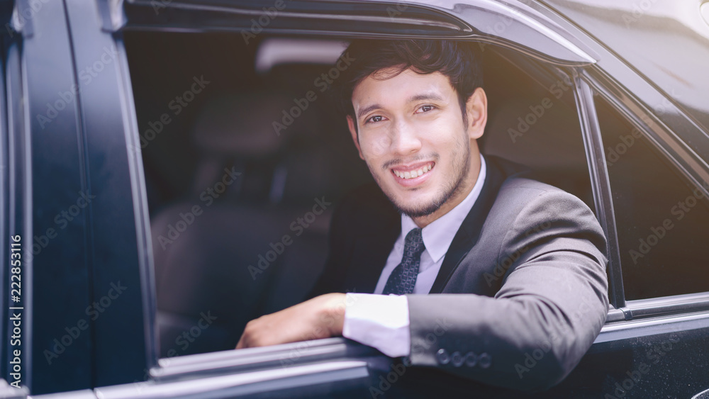 handsome confident businessman sitting in car to business trip.businessman in suit
