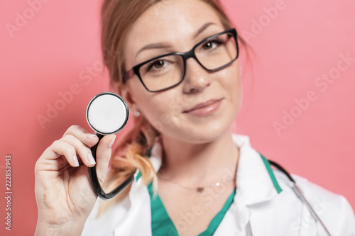 Medical stethoscope in doctor's hand.