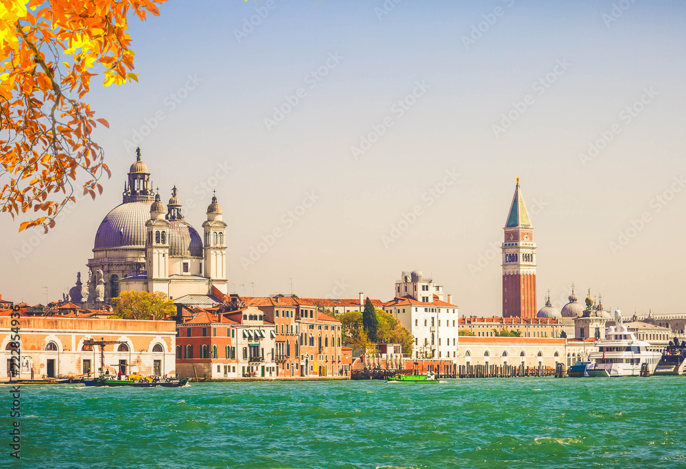 famous San Marco square waterfront with Basilica Santa Maria della Salute and San Marco bell tower, Venice, Italy at fall